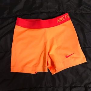 Orange and Red Nike Pro Shorts